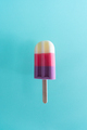 Colored ice cream popsicle on a pastel light blue background. Minimal summer concept - PhotoDune Item for Sale