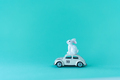 White easter bunny is transported on the beetle car - PhotoDune Item for Sale