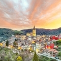 Amazing Panorama of the belltower and the village in the valley at early sunrise. - PhotoDune Item for Sale
