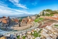 Ruins of ancient Greek theater in Taormina and Etna volcano in the backgroun - PhotoDune Item for Sale