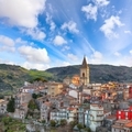 Amazing Panorama of the belltower and the village in the valley at early sunrise. - PhotoDune Item for Sale