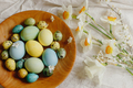 Happy Easter!  Rustic easter flat lay. Stylish easter eggs and blooming daffodils flowers - PhotoDune Item for Sale