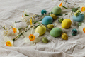 Happy Easter! Stylish easter eggs and blooming spring flowers on rustic table - PhotoDune Item for Sale