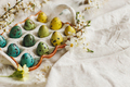 Rustic easter still life. Stylish easter eggs and blooming spring flowers on linen fabric - PhotoDune Item for Sale