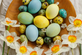 Happy Easter!  Stylish easter eggs and blooming daffodils flowers in wooden bowl on rustic table - PhotoDune Item for Sale