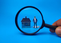Miniature people,house keychain and magnifying glass on blue background. Real estate concept. - PhotoDune Item for Sale