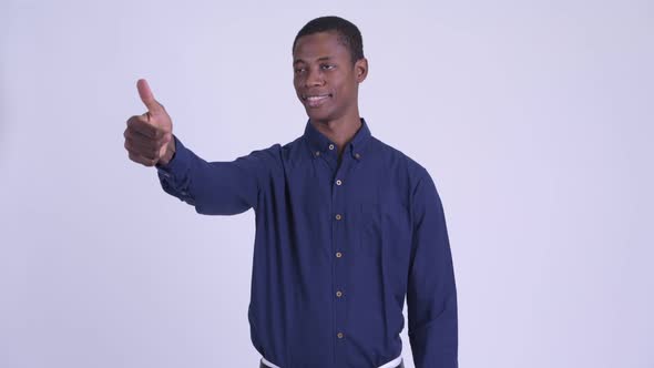 Young Happy African Businessman Giving Thumbs Up