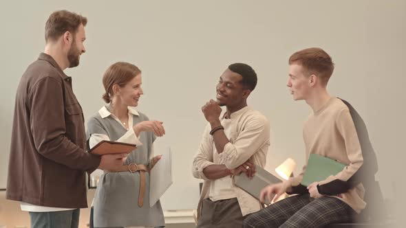 Men and Woman Chatting at Work