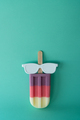 Colored popsicle with glasses on mint background. Minimal summer concept. - PhotoDune Item for Sale
