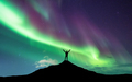Northern lights and silhouette of man with raised up arms - PhotoDune Item for Sale