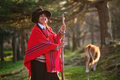 Ecuadorian woman in her traditional clothing and hat holding a long stick  - PhotoDune Item for Sale