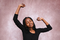 Portrait of Afro woman with raised arms. - PhotoDune Item for Sale