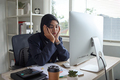 Muslim woman wearing hijab sitting on office chair. Concept of stress at work. - PhotoDune Item for Sale