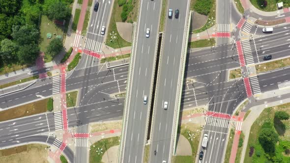 Summer aerial footage of transport junction, traffic cross road junction day view from above with hi