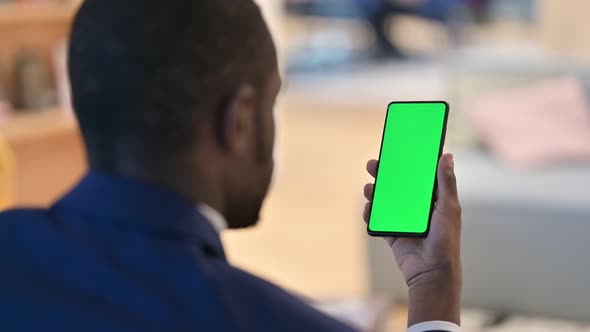 African Man Using Smartphone with Chroma Screen 