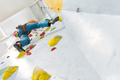 Young Woman rock climbing indoors. - PhotoDune Item for Sale