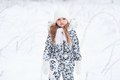 Cute sad unhappy Caucasian frozen girl child standing alone in snow during cold winter snowy day - PhotoDune Item for Sale
