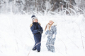 Happy Children playing outdoors in cold winter weather, having fun and throwing snow - PhotoDune Item for Sale