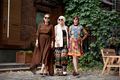 Beautiful middle aged women walking city street. Elderly fashion models wearing stylish clothes - PhotoDune Item for Sale