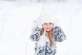 Pretty smiling happy Girl Child in warm clothes, white hat, mittens, covering her ears - PhotoDune Item for Sale