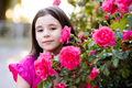 Cute smiling kid girl with rose flowers in park outdoor - PhotoDune Item for Sale