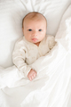 Funny little infant baby wake up in bed  - PhotoDune Item for Sale