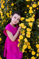Cute smiling kid girl with rose flowers in park outdoor  - PhotoDune Item for Sale