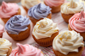 Colorful Birthday cupcakes freshly made collected on the table in a selective focus - PhotoDune Item for Sale