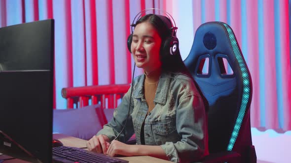 Young Asian Gamer Girl Smiling To The Camera