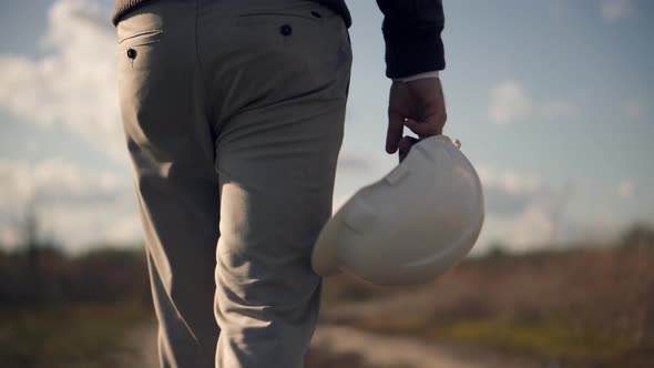 Foreman Designer On Construction Site. Civil Engineer Developer With Helmet. Builder Constructor.