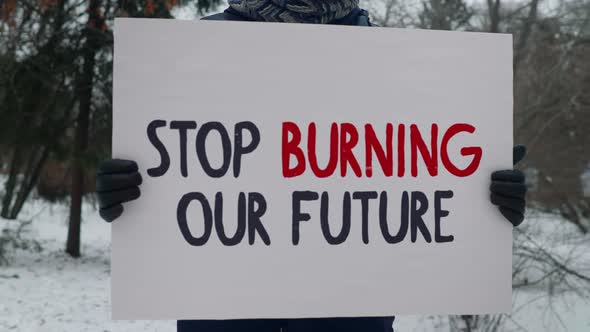 Stop Burning Our Future Banner Calls Out Corporations To Cease Ecology Pollution