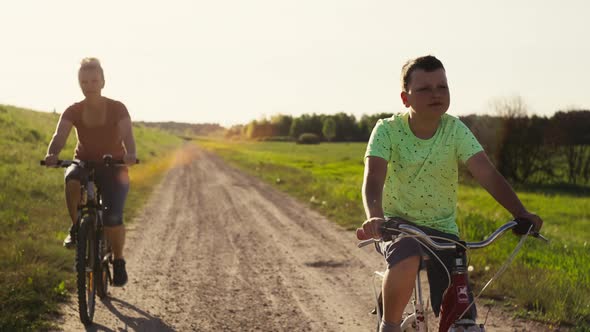 Family Spends Time Together in Nature Riding Bicycles