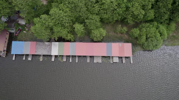 Top-down shot of huts by the lakeside of Lake Mirow in Germany.