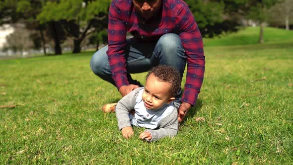 Mixed-race Little Boy Lying on Grass