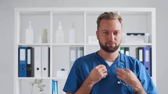 Professional medical doctor in hospital office, Portrait of young and confident physician.