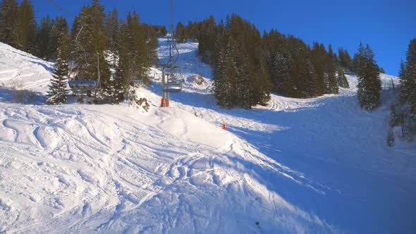 ski area in the Swiss alps with people and chairlifts in the winter ski area of ​​Beckenried