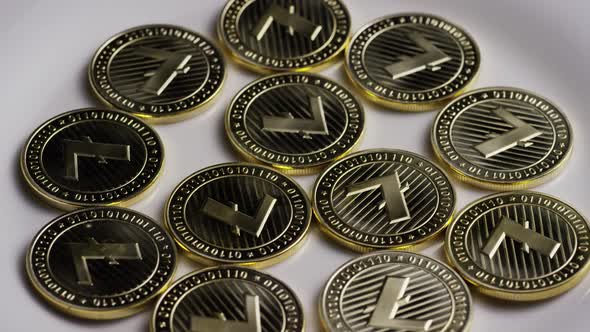 Rotating shot of Litecoin Bitcoins (digital cryptocurrency) - BITCOIN LITECOIN