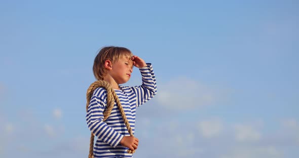 Kid having fun outddor against blue summer sky