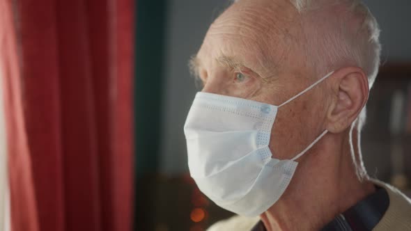 Portrait of Elderly Old Man with Short White Hair Wearing Face Medical Mask for Protection Virus