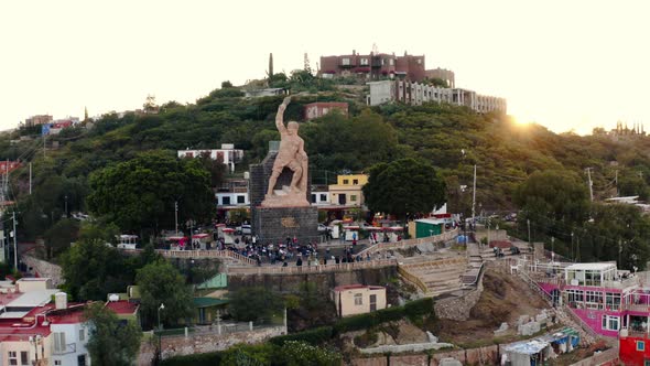 AERIAL: Guanajuato City and The Pipila, Sunset, Mexico (Flying Around)