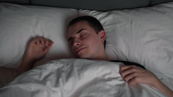 Calm Smiling Handsome Man Goes To Sleep Comfortable Cozy Fresh Bed Enjoying Healthy Good Sleep Nap