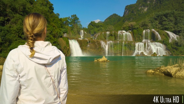 4K Female Tourist Walking in Front of the Ban Gioc Waterfall Vietnam