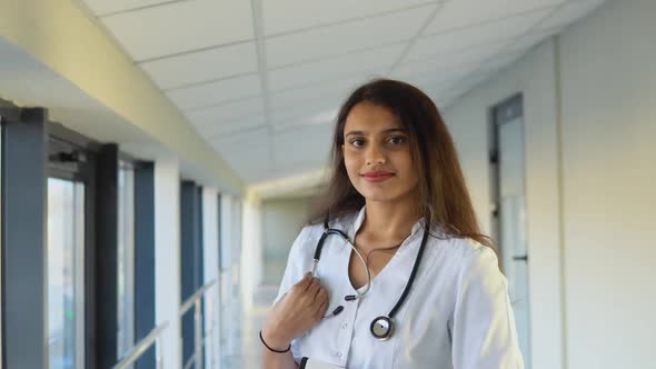 Friendly Happy Indian Woman Physician or Nurse Professional General Practitioner Posing with