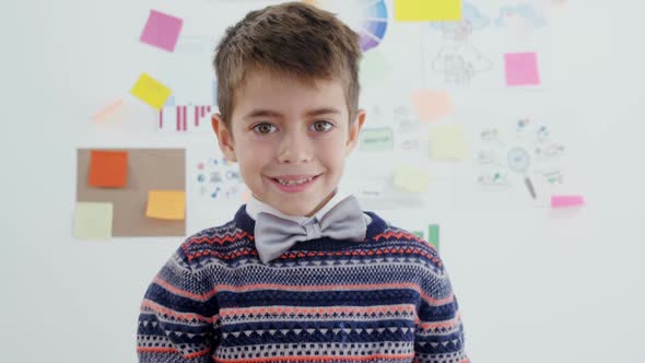 Smiling boy in office 4k