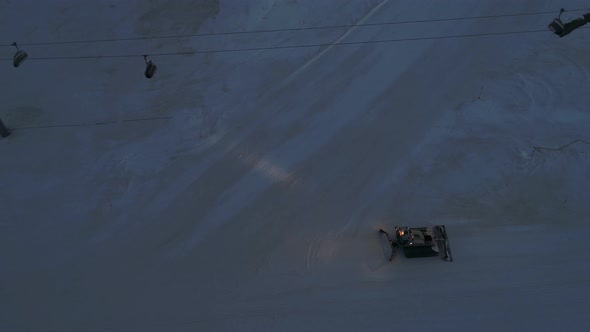 Aerial Snowcat Works At The Ski Slopes