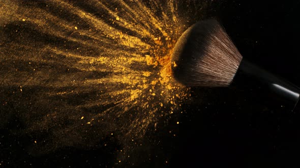 Super Slow Motion Shot of Makeup Brush and Brown Powder Falling on Black Table at 1000 Fps