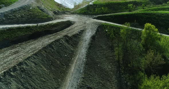 Drone flight over the garbage dump hill.