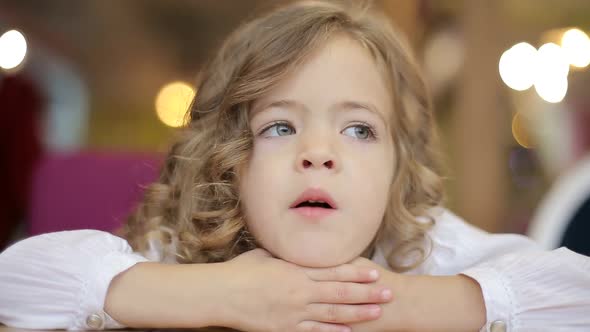 Close up portrait of adorable 3 years old girl, little girl looking at the camera