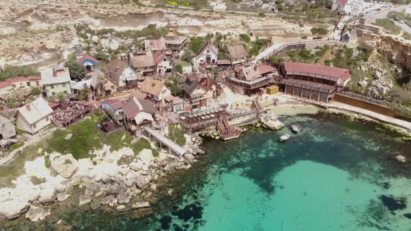 Popeye Village fun park and turquoise mediterranean water on Anchor Bay, in Malta