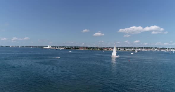 Sailboats entering and leaving Mt. Hope Bay in Newport Rhode Island as well as returning from Block